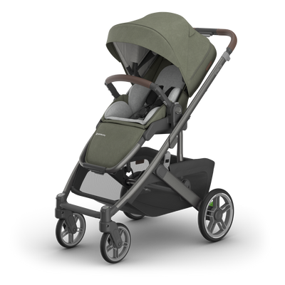 UPPAbaby Cruz V3 Pram - Evelyn (Meadow Green), three quarter left with infant insert