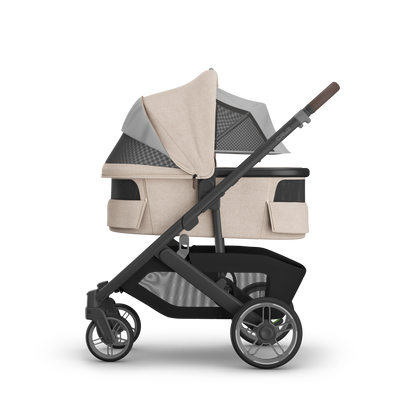 UPPAbaby V3 Bassinet - Liam (Oat Melange / Carbon), on Cruz V3, side, all vents open