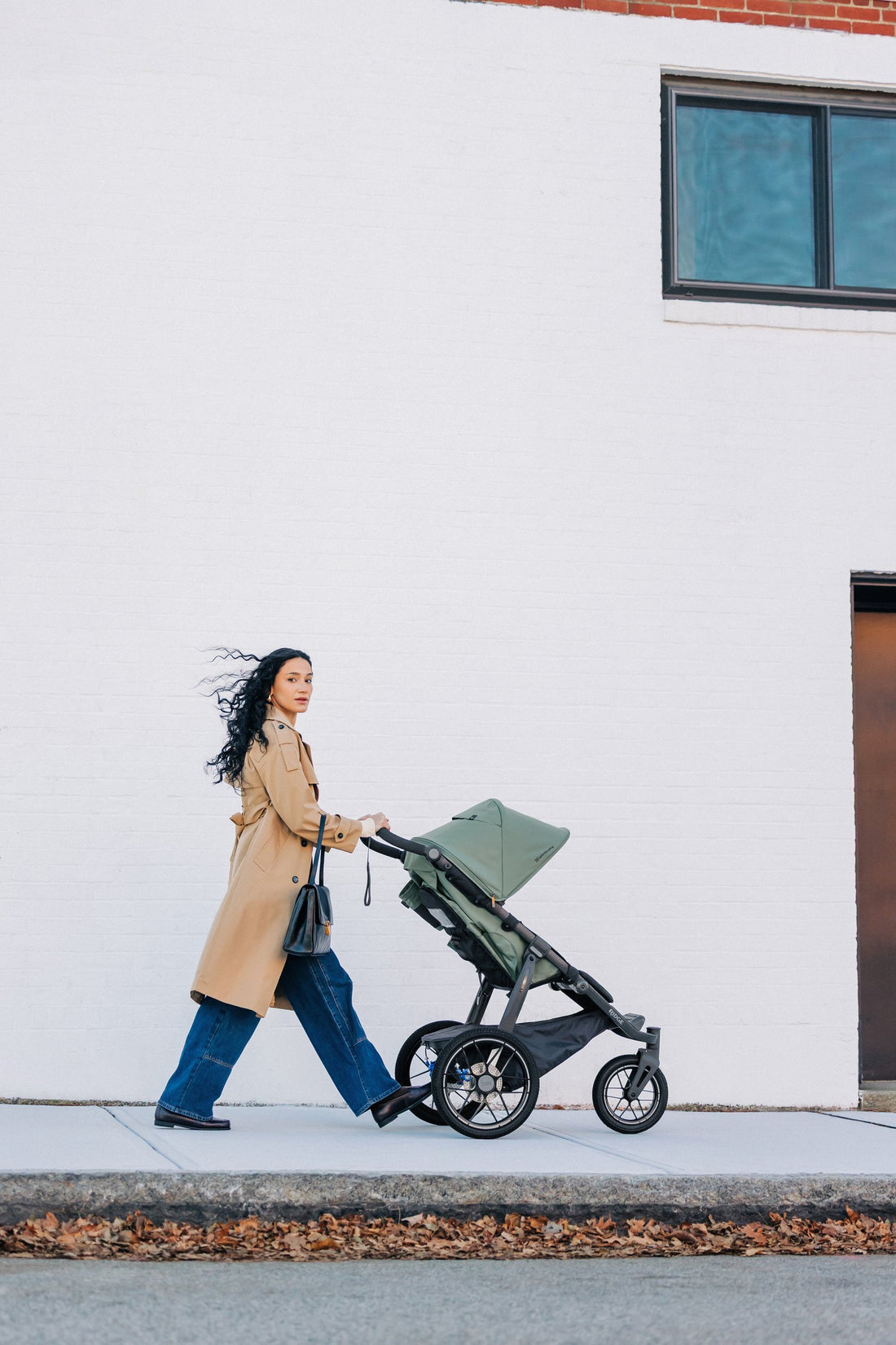 UPPAbaby Ridge V2 Pram Jogger in Evelyn (Meadow Green), on a city walk