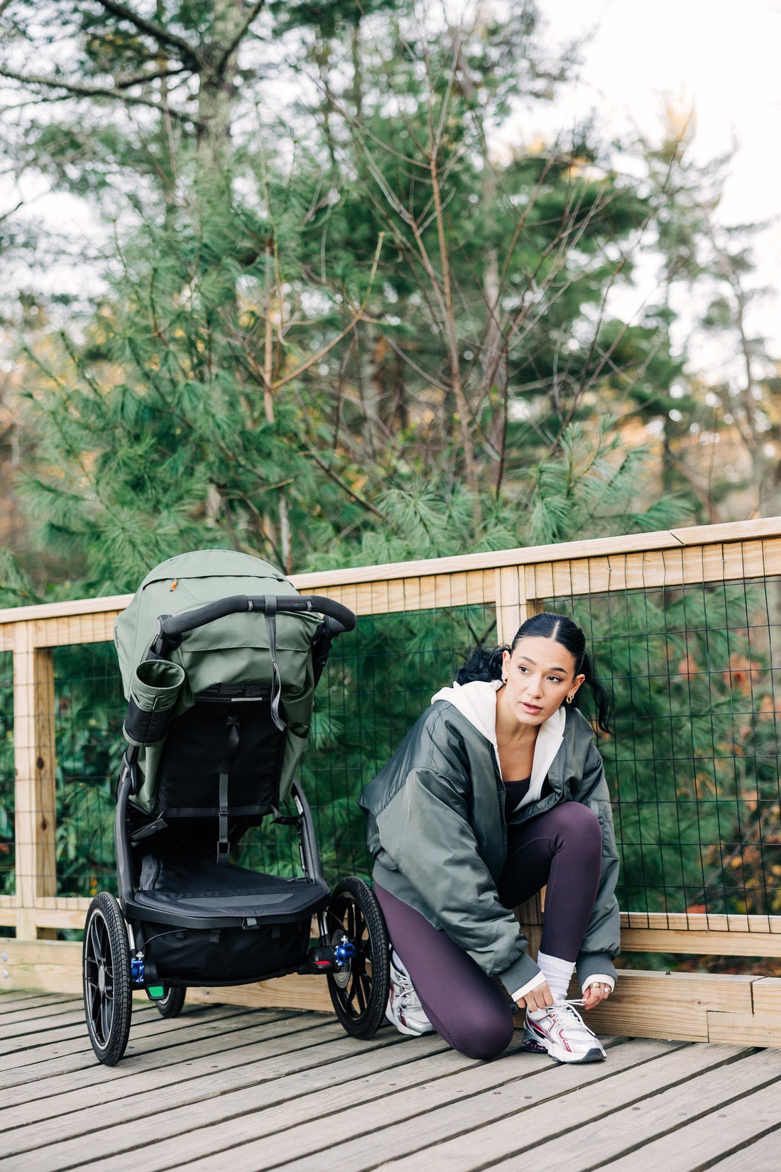 UPPAbaby Ridge V2 Pram Jogger in Evelyn (Meadow Green), stretching before a run