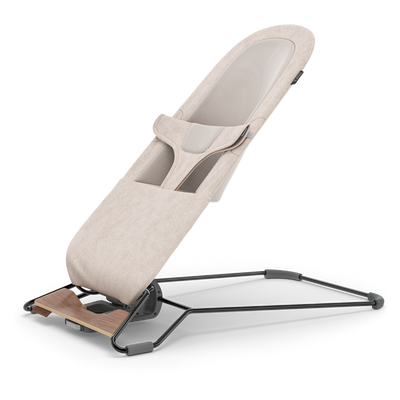UPPAbaby Mira Baby Bouncer - Charlie (Sand Melange / Black Chrome / Walnut Wood), three quarter left