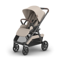 UPPAbaby Kona pram in Ada (sandstone melange), three-quarter view from the left