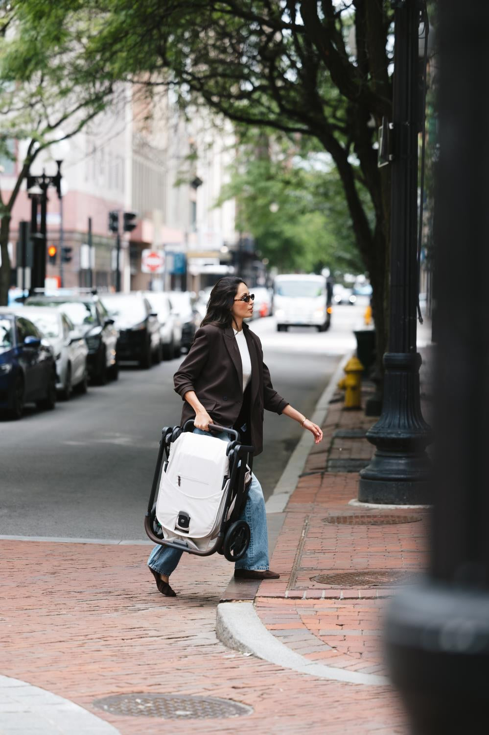 Carrying a folded Kona across a city street